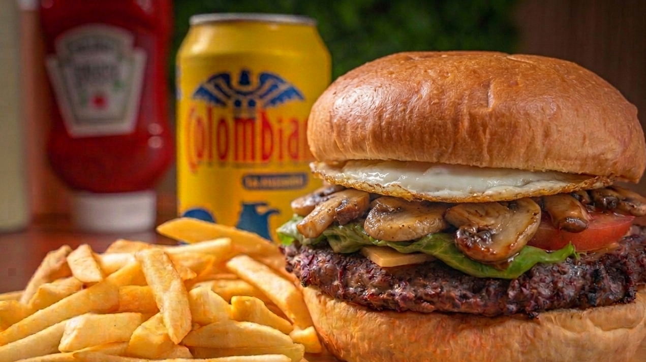 Colombian burger with mushrooms, cheese, egg and fries at Americas Bakery and Restaurant in Davie.